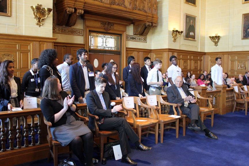 Attendees at the Supreme Court Law Day program applaud students from Bloomfield and Hartford.