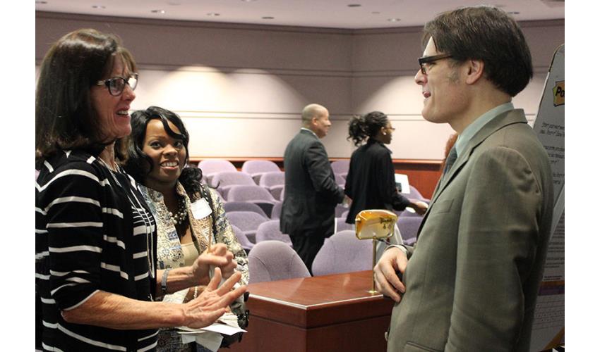 Yale Professor Dan M. Kahan discusses his lecture with two Judicial Branch employees.