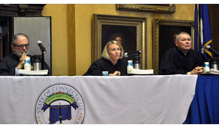 Chief Justice Chase T. Rogers concludes the morning ceremony. Justice Peter T. Zarella is to her right;<br>Justice Dennis G. Eveleigh, to her left.