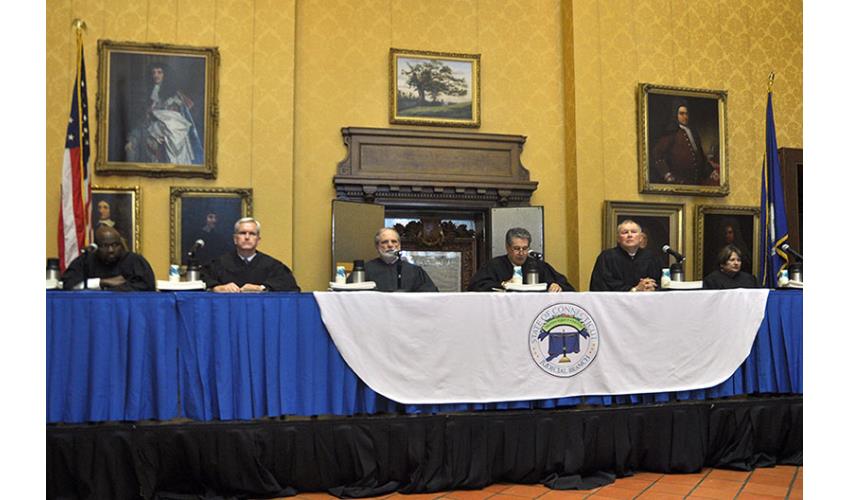 Justices at the afternoon ceremony were, left to right:  Justice Richard A. Robinson, Justice Andrew J. McDonald, Justice Peter T. Zarella, Justice Richard N. Palmer, Justice Dennis G. Eveleigh and Justice Carmen E. Espinosa.