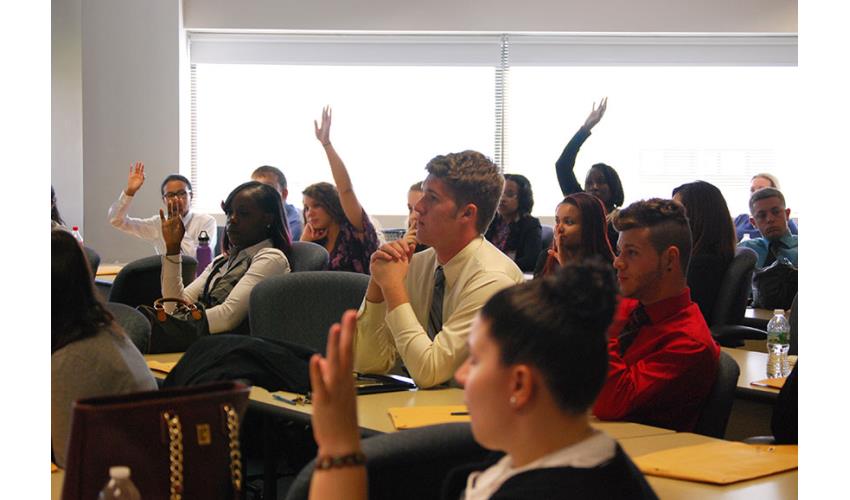 Interns test their civic knowledge during an exercise.