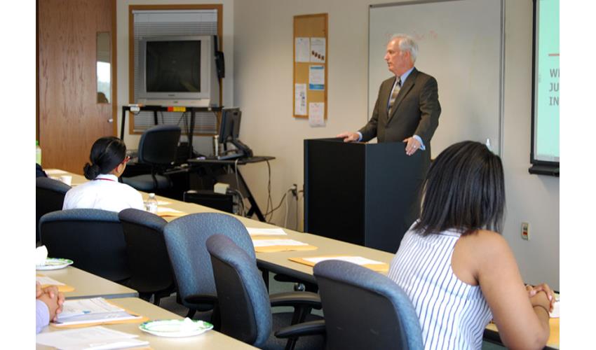 Judge Mark Gould instructs the interns about their responsibilities.