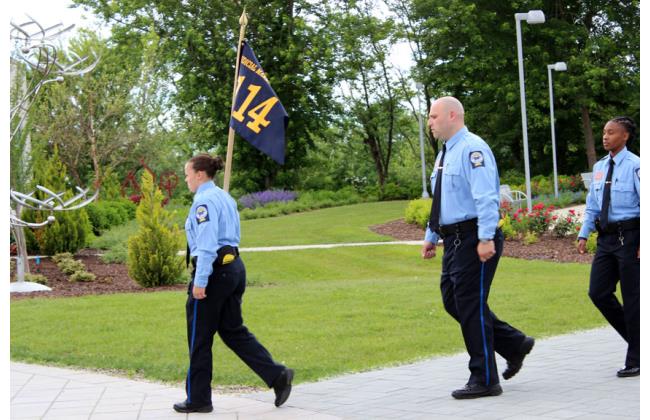 Class 114 Flag Bearer leads the procession.