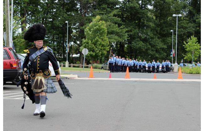 A CT State Police piper arrives as the Judicial Marshal candidates march to graduation.